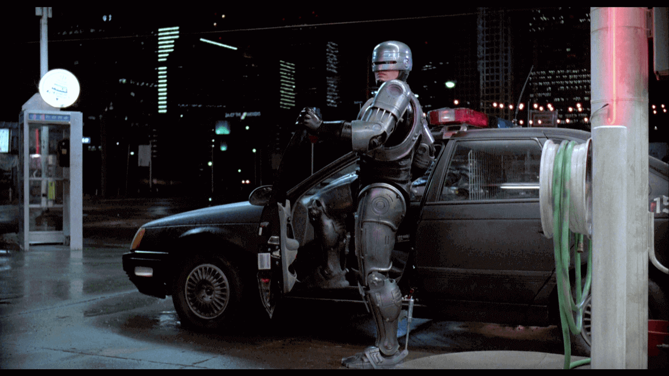 Robocop with police car version of Ford Taurus in still from 1987