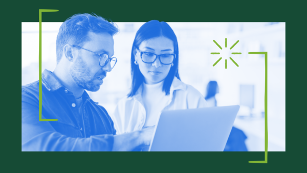 Two people at work. The accompanying blog post shares how Atlassian redefined its AI superuser metric three times in 18 months — moving from tracking weekly active users to measuring function-specific adoption — and identifies the behaviors and traits CHROs should hire for.